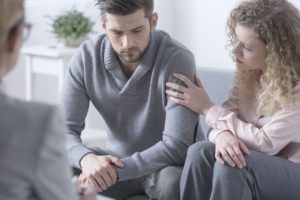 Wife Comforting Husband in Marriage Therapy Session